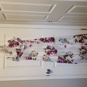 White floral maxi dress with halter style and back zipper. Good condition.